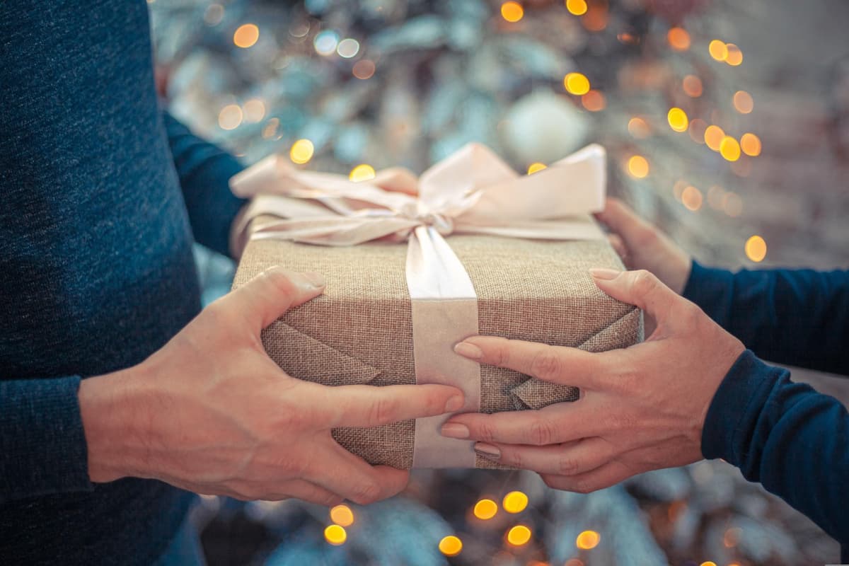 Hands offering gift